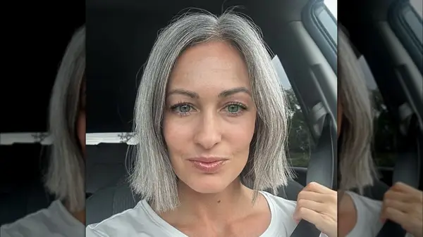 A woman with silver hair and a blunt bob