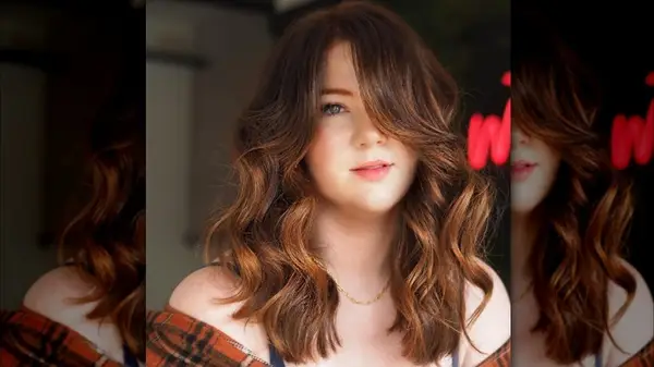 shallow side part and curtain bangs