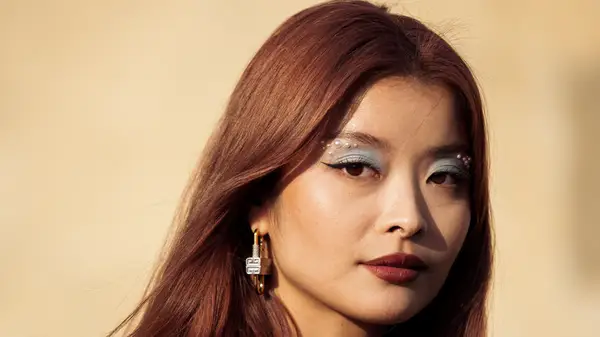 A woman with light blue shadow 