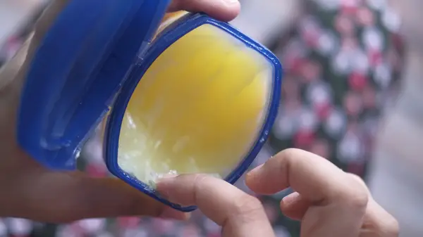 Hands holding vaseline