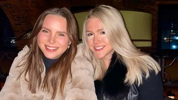 Karoline Leavitt posing with a friend with very light undereye makeup