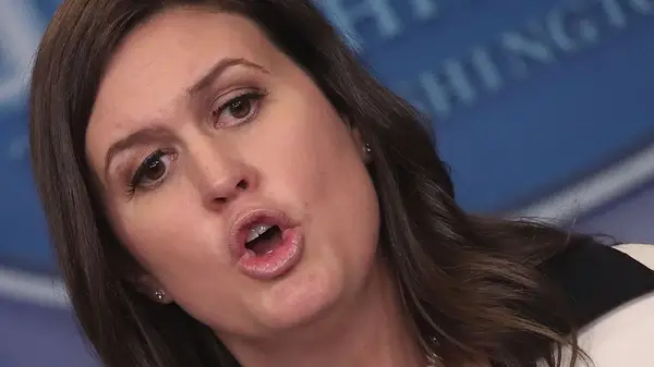 Sarah Huckabee Sanders with an unglued eyelash at a press briefing