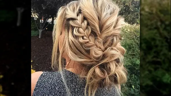 Braided messy bun back of woman