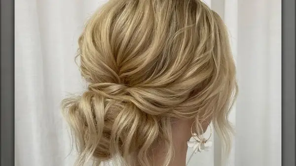 Blonde woman with low messy bun 