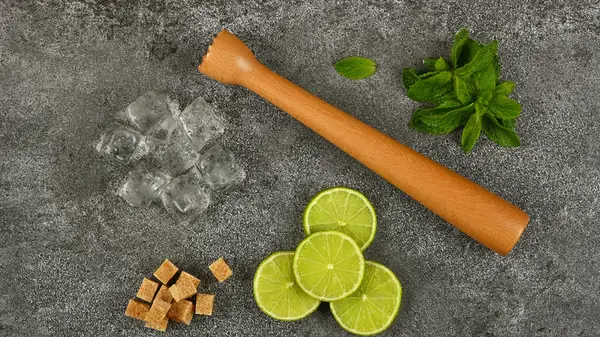 mojito ingredients and masher
