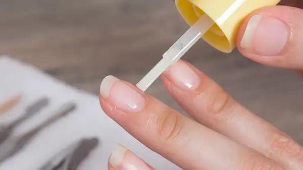 applying nail oil