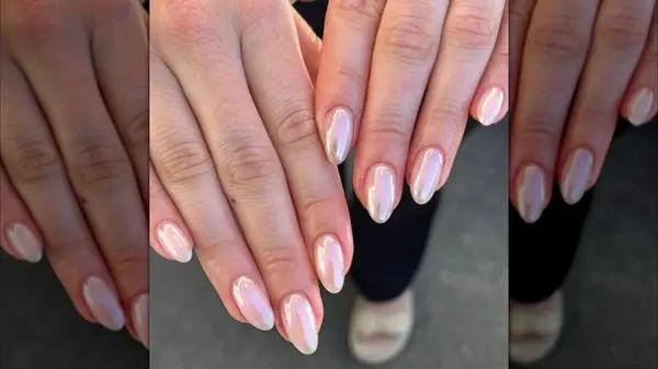 A photo looking down on a metallic light pink manicure