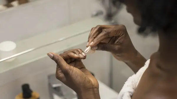 Woman removing polish