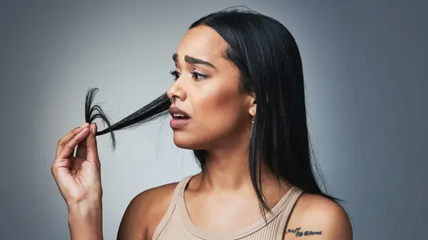 Woman looking at hair 