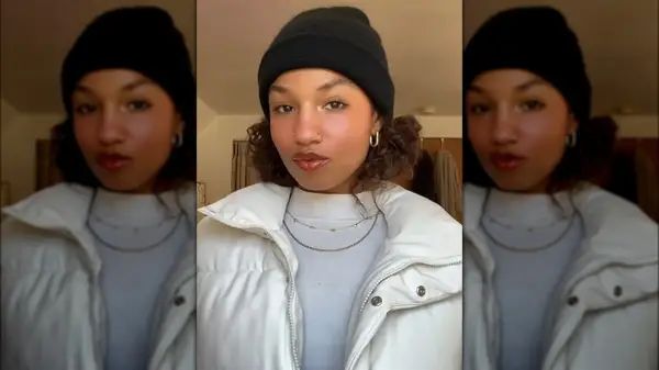 Woman with hair buns and a hat