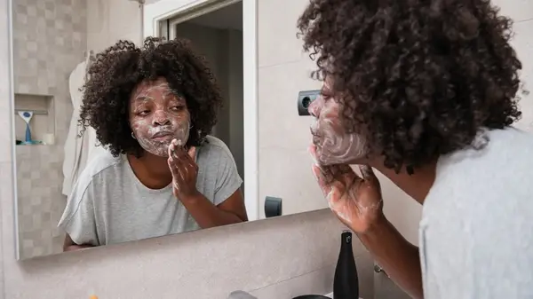 A woman washing her face