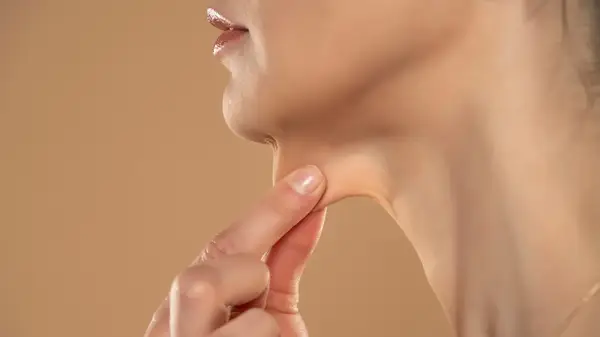 A woman pinching her skin