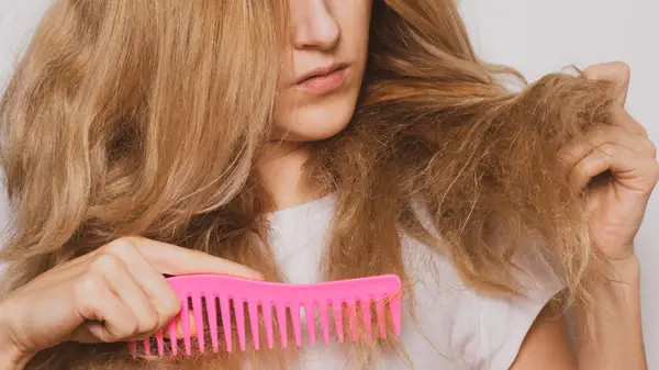 Woman combing her hair