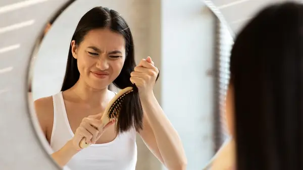 Woman brushing her hair