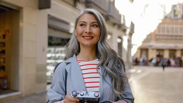 Woman with long grey hair