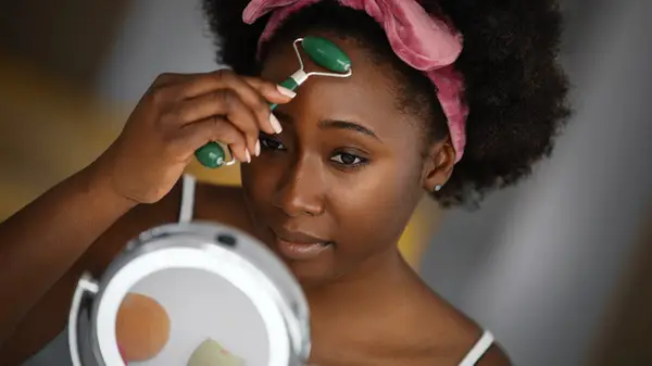 woman with face roller