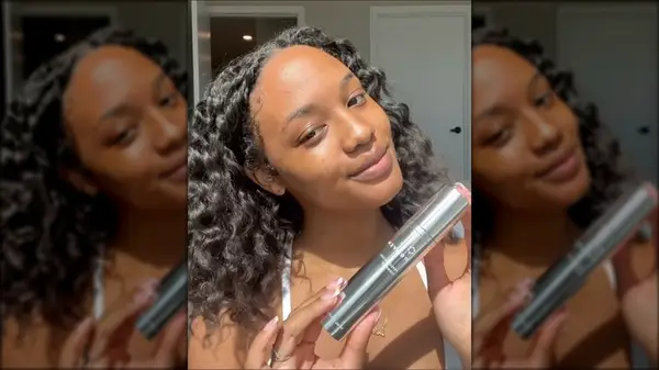 Woman holding a Proven skincare product