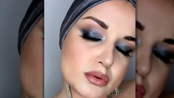 Woman wearing dark frosted shadow 