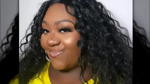 Woman wearing frosted cheek highlighter 