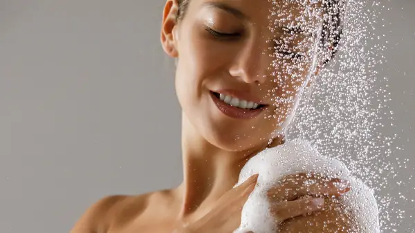 A person selecting from a set of acne products