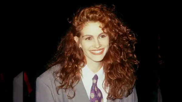 Julia Roberts wearing a gray suit 1990