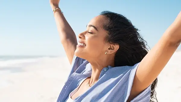 Woman smiling at beach