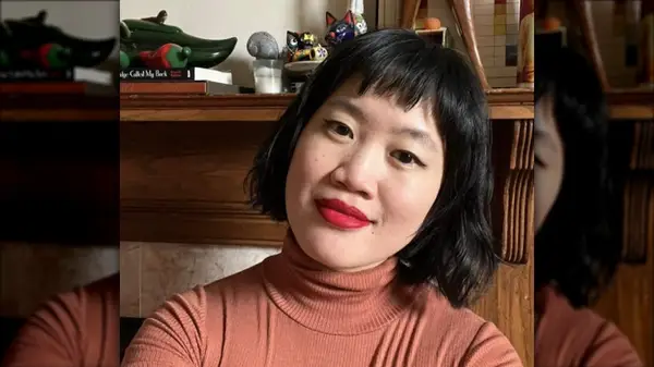 Woman with a French bob, smiling in selfie