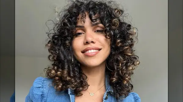 A woman with a curly shag
