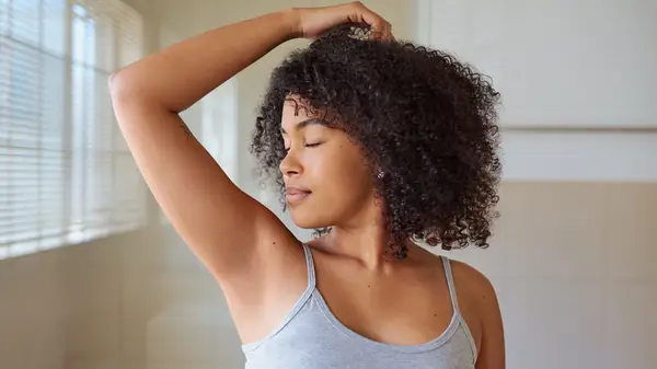 Woman smelling herself