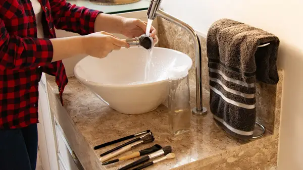 Washing makeup brushes