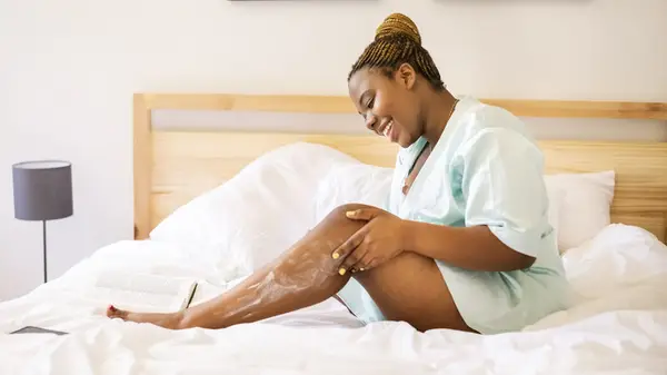 Woman applying coconut oil