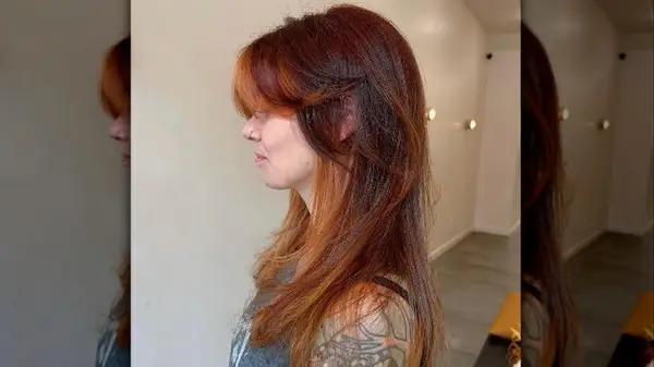 Woman with curtain bangs