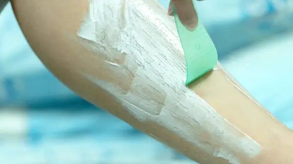 spatula removing hair removal cream