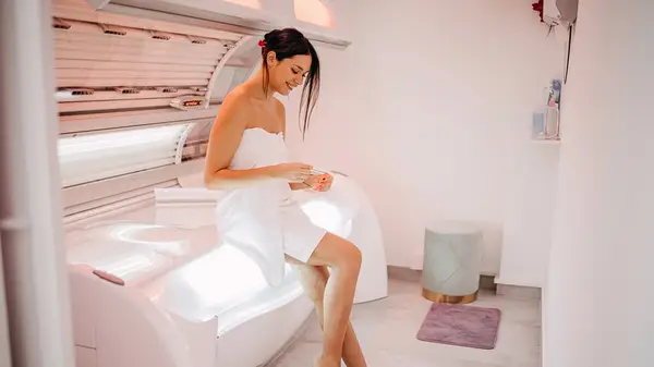 Woman in a tanning bed