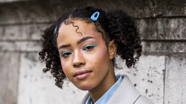woman with curly pigtails in hair clips 