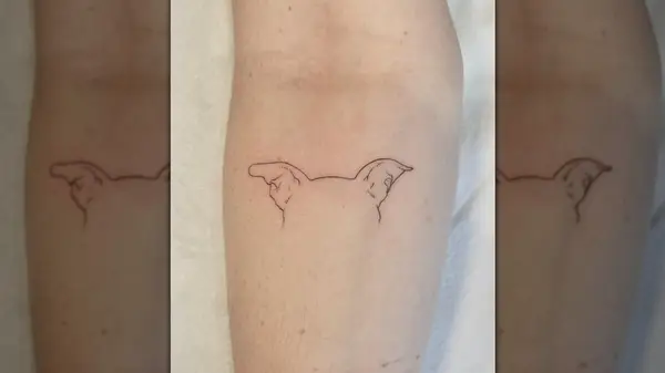 Dog ear line tattoo