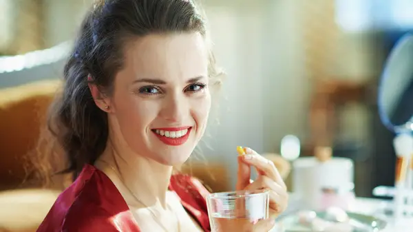 Woman taking zinc supplement