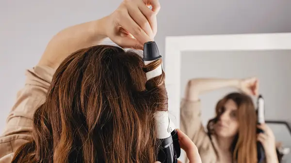 Woman doing her hair 
