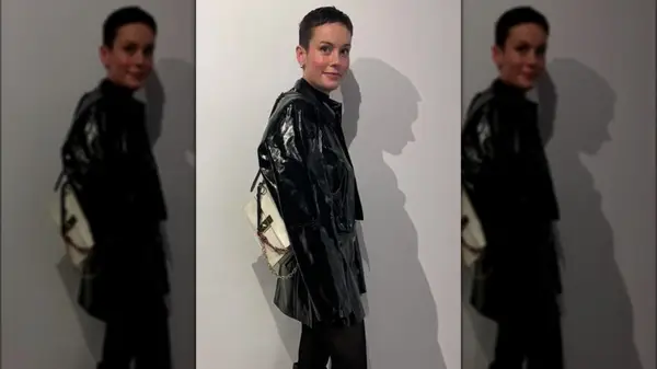 Brie Larson on Instagram with a pixie cut, wearing a leather jacket