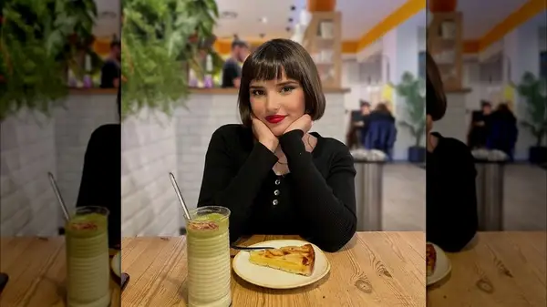Woman with a bob and blunt bangs
