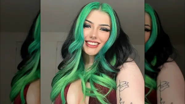 Woman with green and black hair