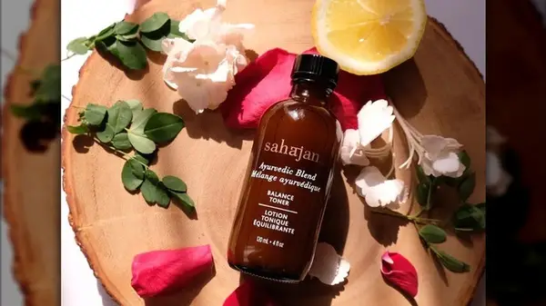 Sahajan product surrounded by leaves 