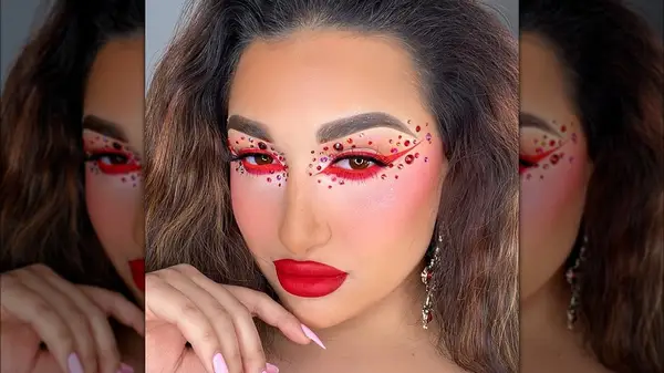 Woman wearing red face gems