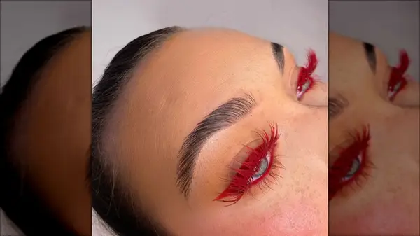 Woman wearing red false eylashes
