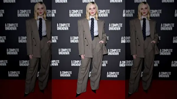 Elle Fanning in a suit and tie