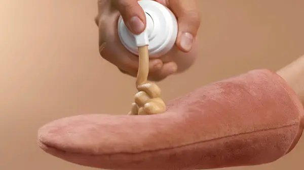 Woman using tanning mousse