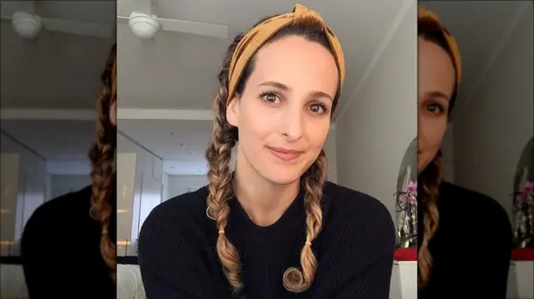 Woman with braid pigtails and a headband