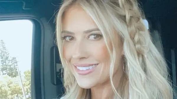 Christina Haack in her car wearing orange blush and bronzer