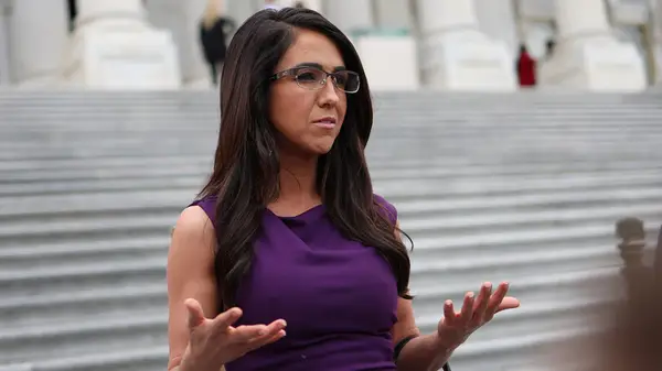 Lauren Boebert at an event in a purple, sleeveless dress in May 2024