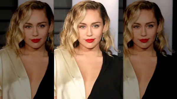Miley Cyrus on the red carpet with a red lip